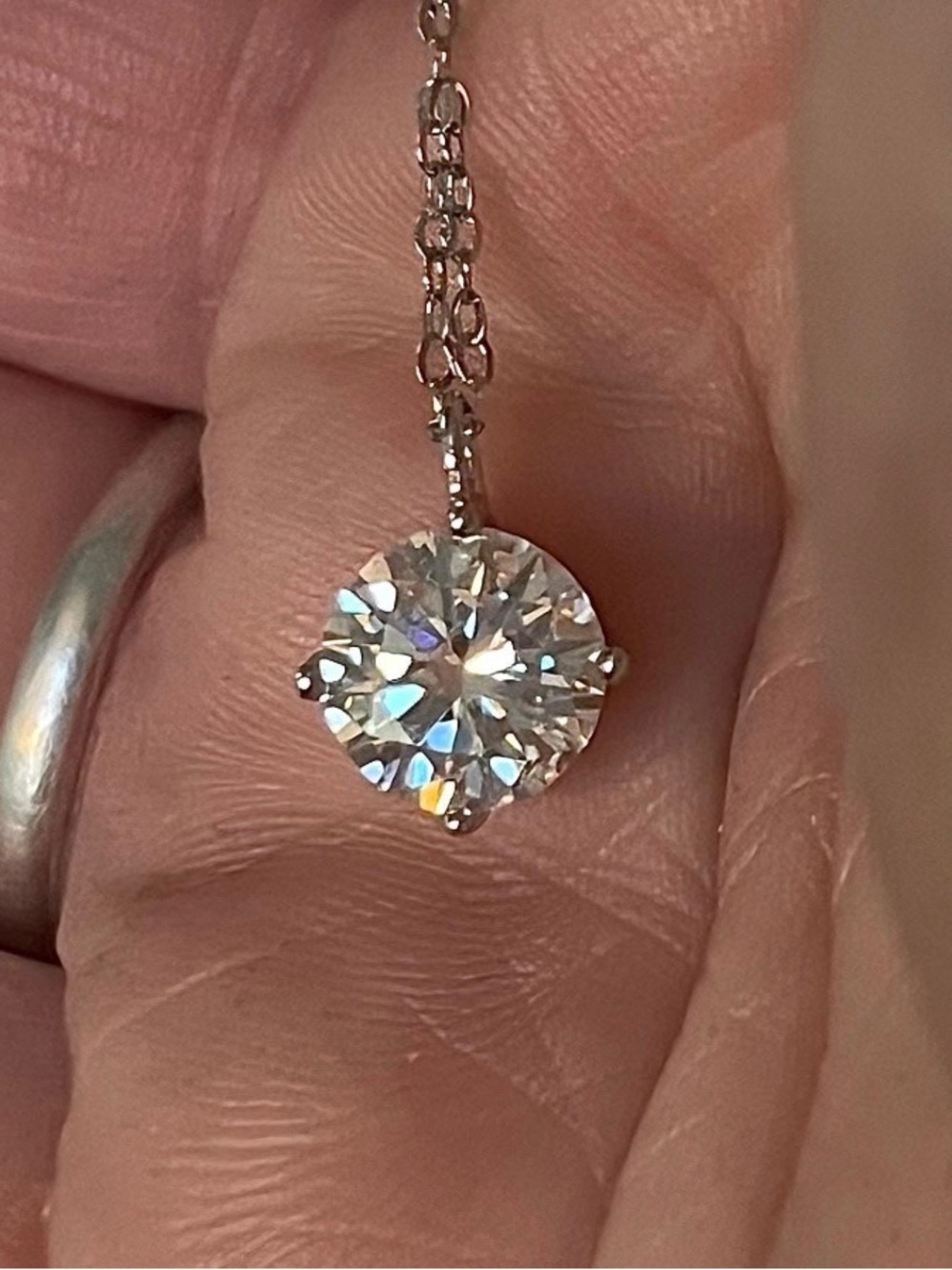 A 2ct “Floating” Moissanite solitaire in sterling silver and 18k white rhodium!